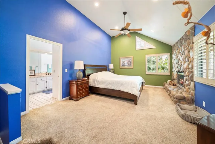 Primary bedroom w/stone fireplace