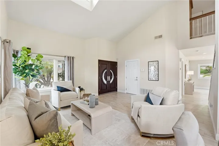 Living room and front entry door.
