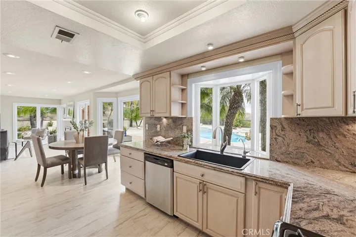 Breakfast nook and the kitchen overlook the yard and view