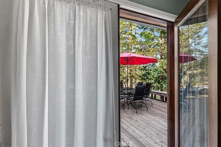 door to hot tub and deck from bedroom
