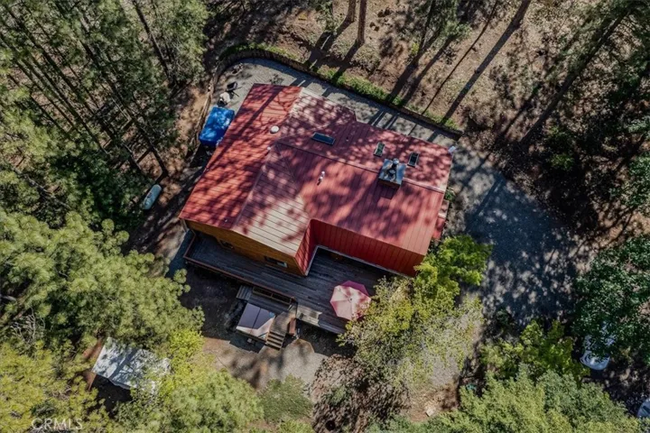 main house with newer metal roof