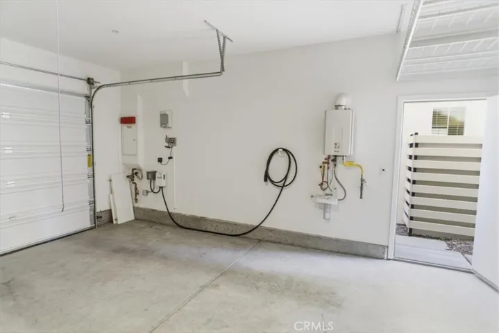 Garage with Car Charger and Overhead Storage