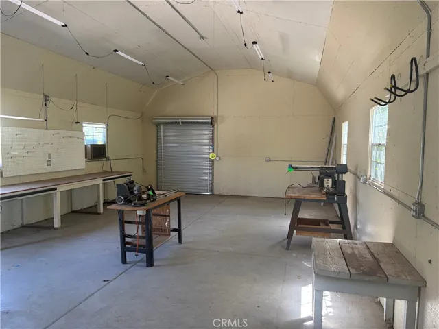 Work shop with view of back roll up door