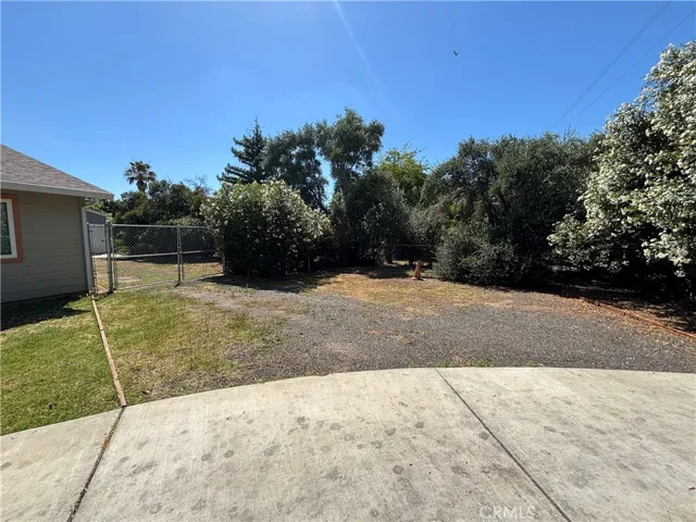 Side yard offers access to workshop and back yard