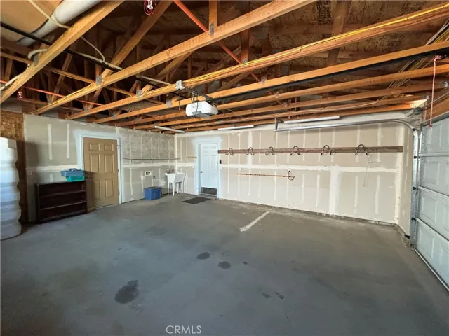 Laundry area and laundry sink in garage