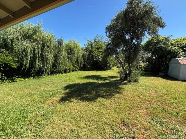 Lush back yard with mature landscaping