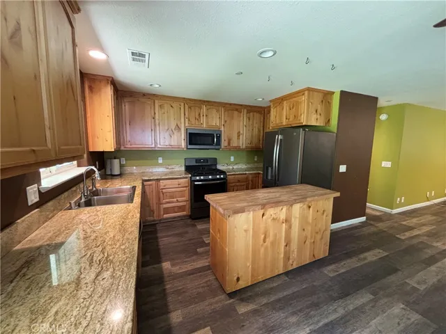Kitchen with moveable island open to dining room