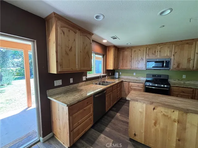 Kitchen with slider access to covered pation and back yard