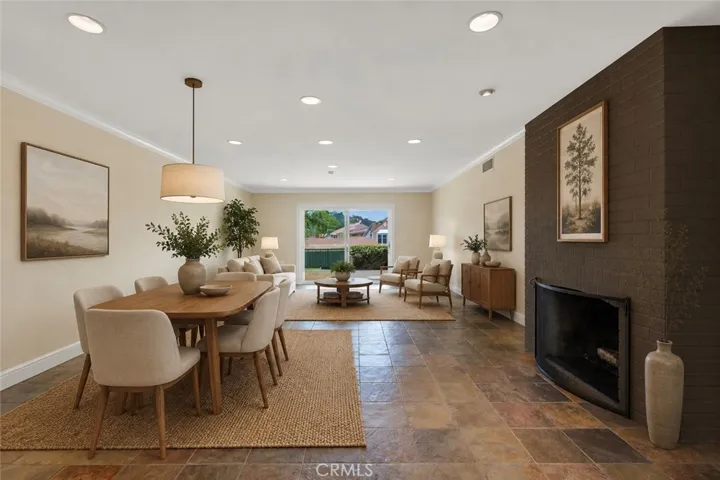 Virtually staged and digitally altered Living & dining room area.