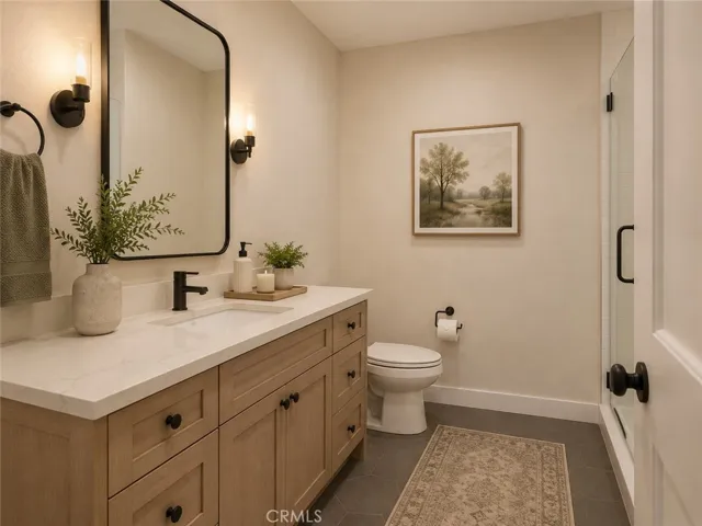 Virtually staged and digitally altered downstairs bath.