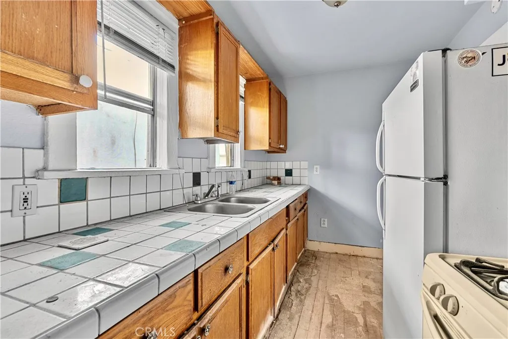 Actual kitchen in one of the units, ready for refresh.