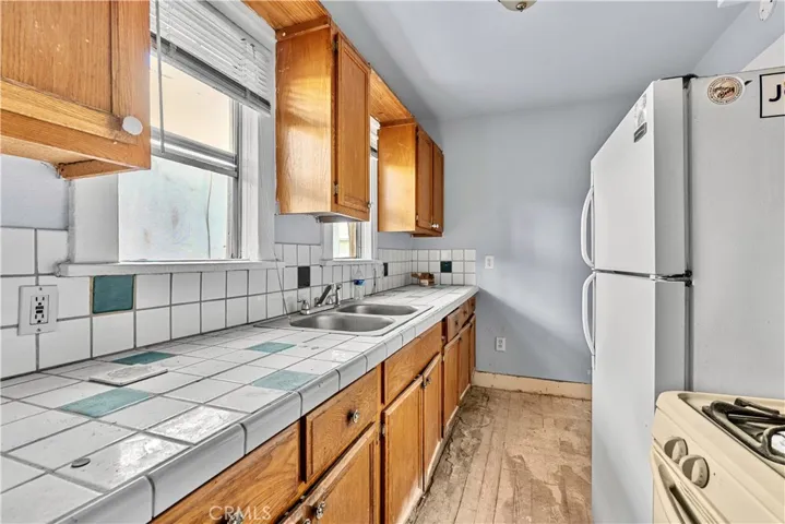 Actual kitchen in one of the units, ready for refresh.