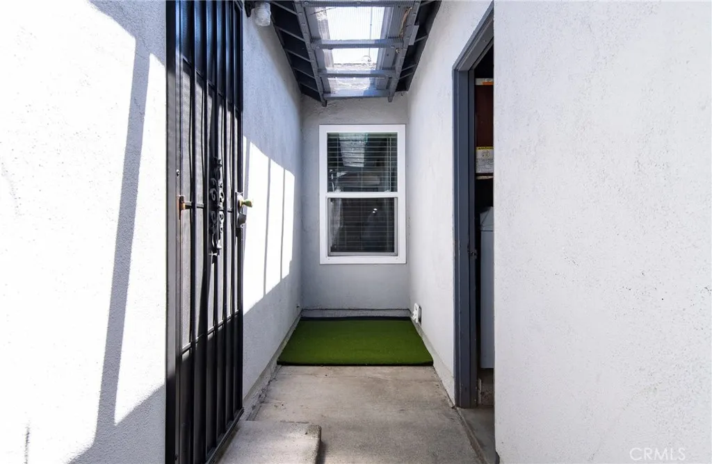 Private entrance to Bonus Room from garage and side yard.  Metal screen door for extra security.