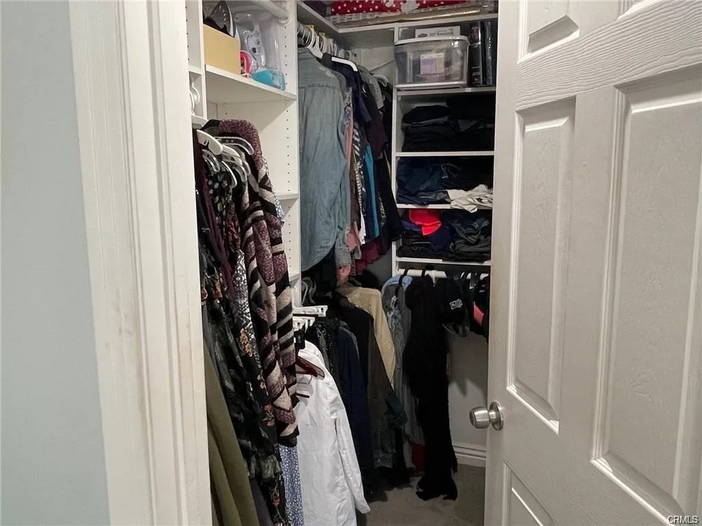 Walking closet in master bedroom