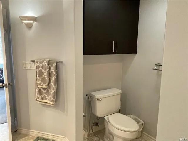 Toilet with cabinet in master bath