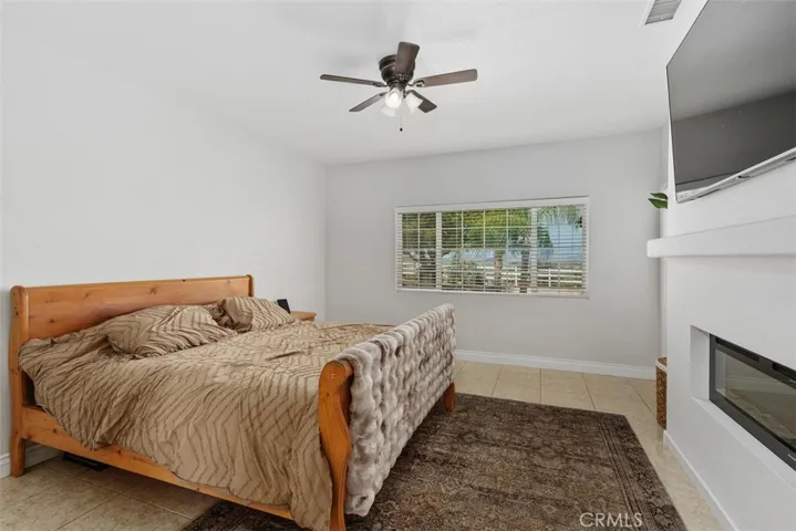 Primary bedroom offers a spa style bath and electric fireplace