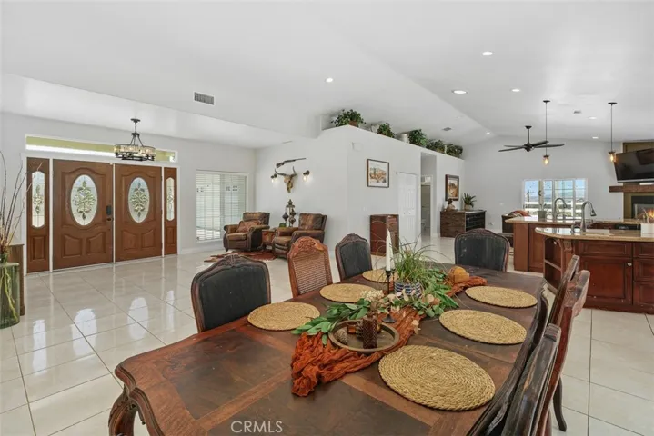 A seamless transition from the entry to the dining, kitchen, family room to the pool and playground beyond.