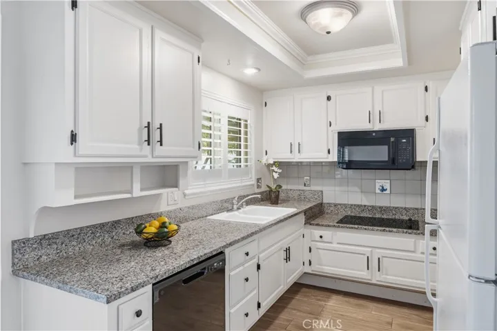 Freshly painted cabinets, granite counters