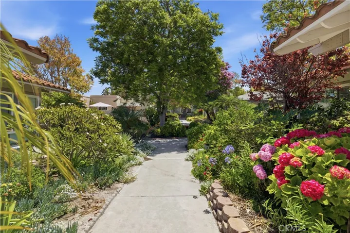 Beautifully landscaped, flower-lined walkway