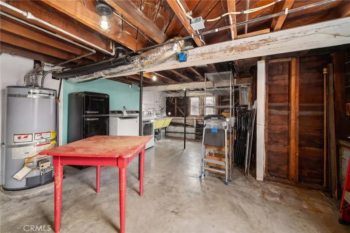 Large finished basement with laundry, sink and storage
