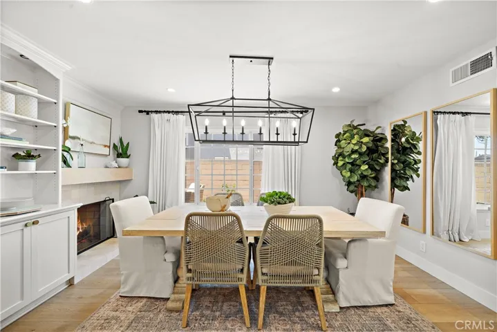 Dining room with fireplace and custom built-in shelving and cabinetry