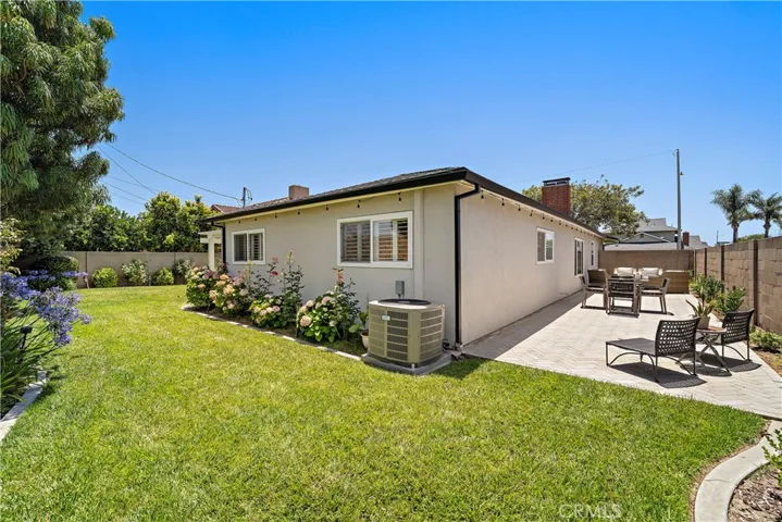 Side yard has another complete patio area or can be for RV