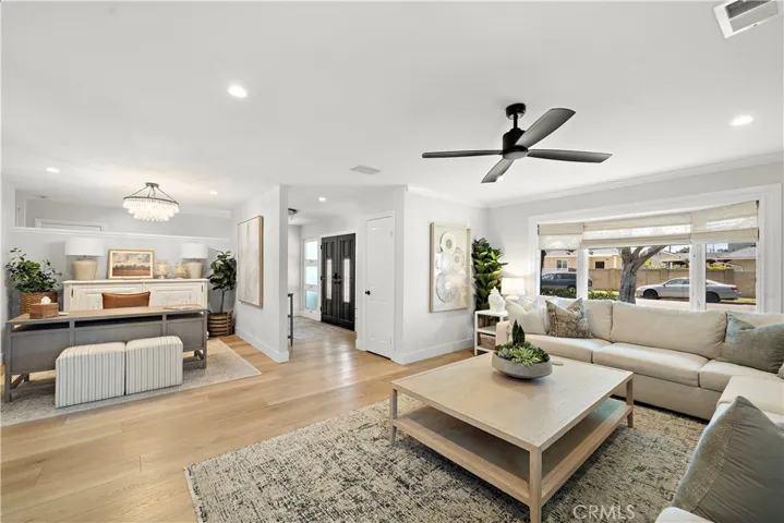 Double door entry to foyer. Formal living room with alcove for office/den. Luxury wide plank vinyl flooring, recessed lighting, crown molding, bay window