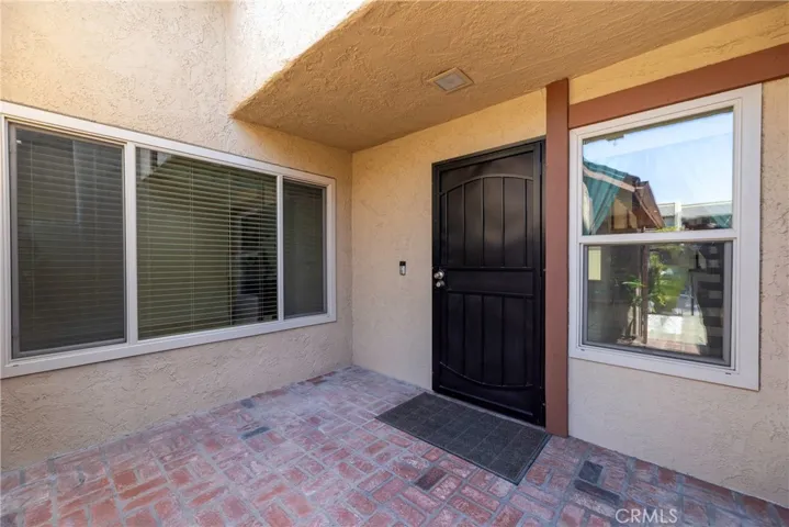 Gated front patio and security door.