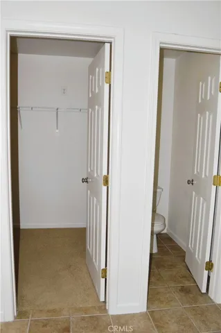 Master walk in closet and water closet for toilet