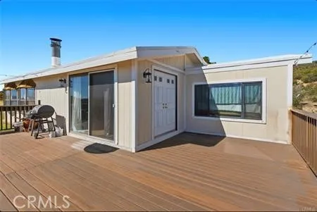 Manufactured home double front door and sliding glass door, with new deck