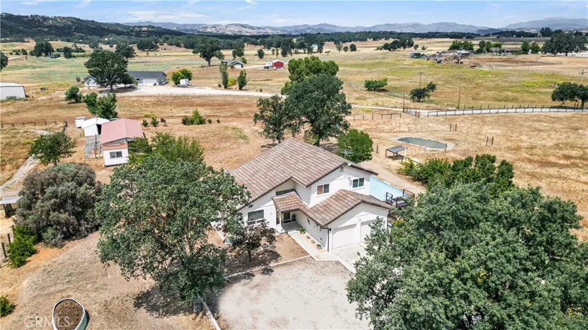 Front of Home with Abundant Trees and Panoramic Views