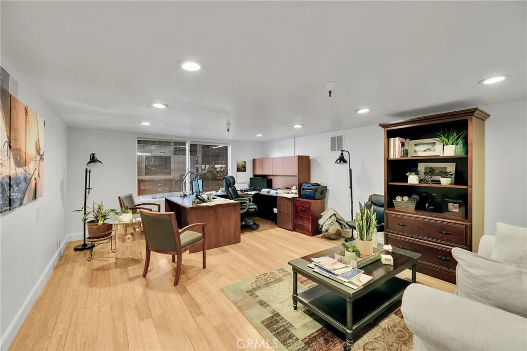 3rd office featuring an interior viewing window to warehouse work area