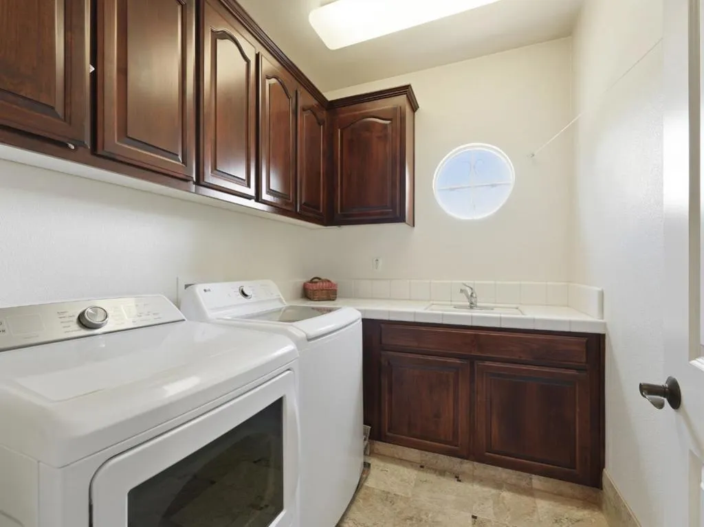 Laundry Room with Sink and Storage Cabinets / Gas or Electrical Dryer