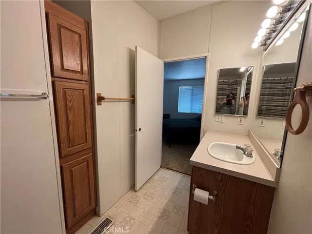 Main bathroom with storage closet