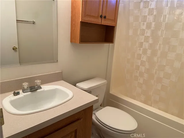 Second bathroom. Tub in shower.