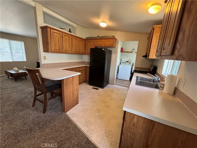 Kitchen with eating bar.