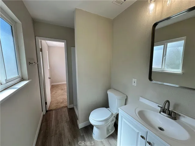Bathroom – Convenient bathroom with updated vanity, modern lighting, and easy access to adjacent living spaces.