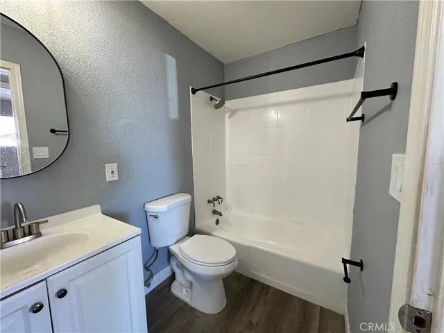 Guest Bathroom – Freshly updated full bath featuring a tub/shower combination, contemporary fixtures, and durable flooring for low-maintenance living.
