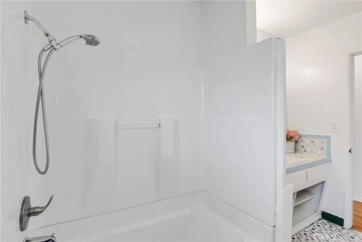 Hall bath, shower in tub