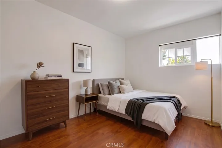 Converted garage Bedroom 1, digitally enhanced and virtually staged