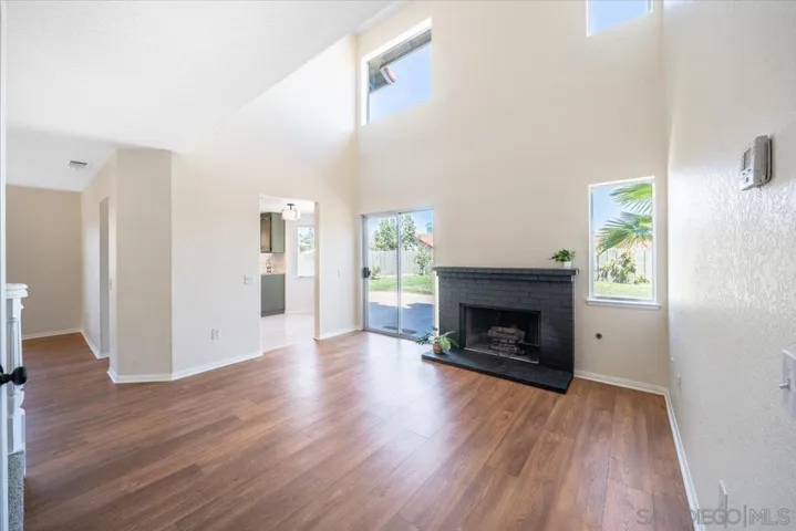 fireplace open to backyard & kitchen