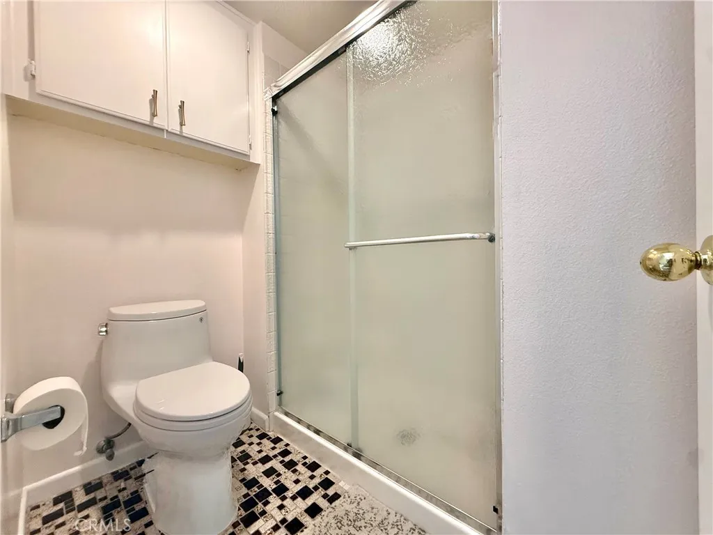 Separate shower area in the primary bedroom.