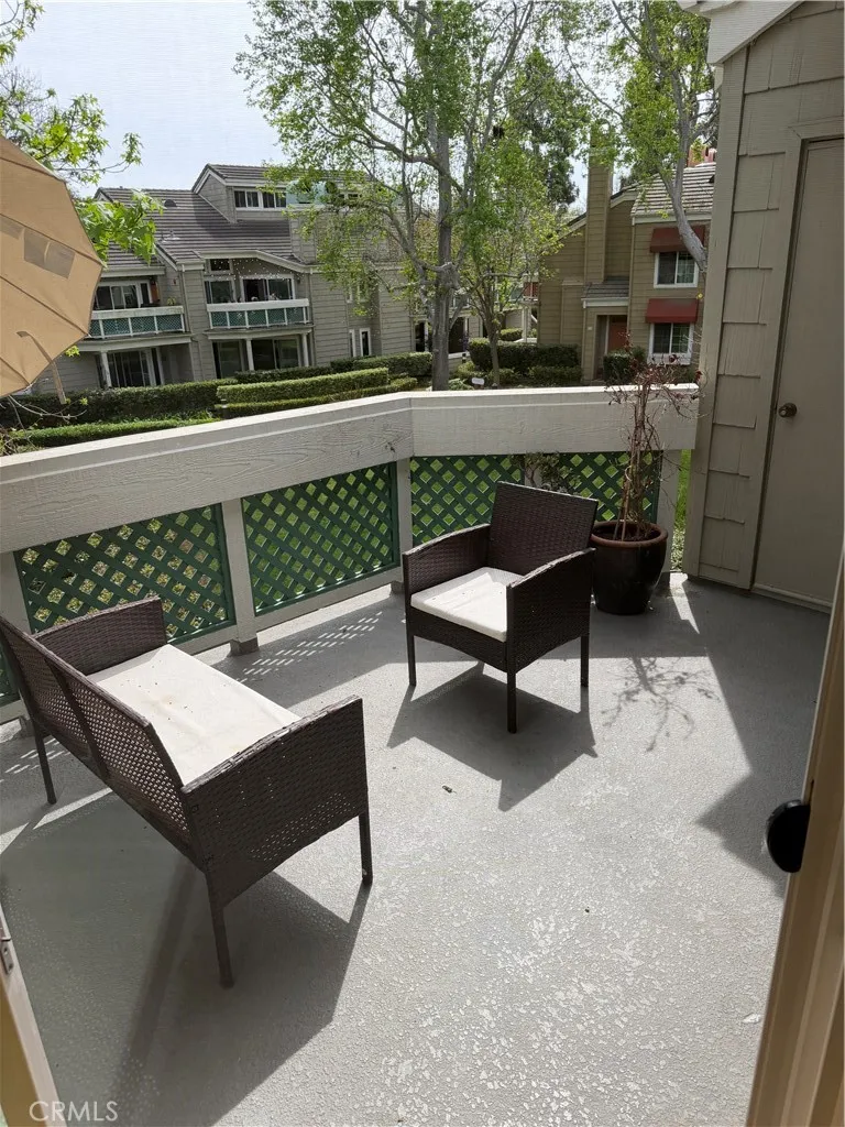 Outdoor patio. Accessible from the sliding glass doors at the living room and primary bedroom.