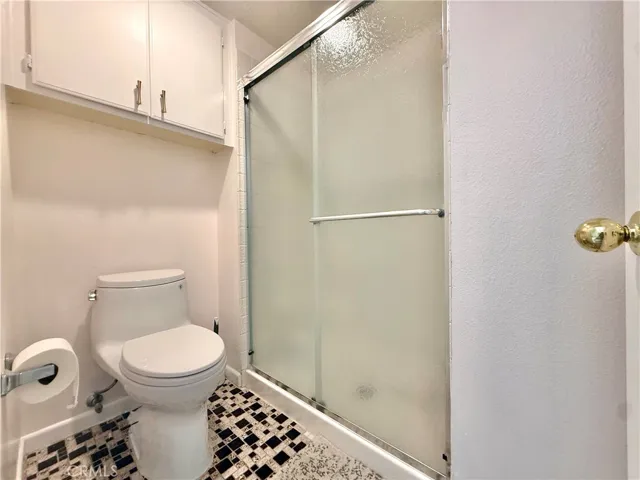 Separate shower area in the primary bedroom.