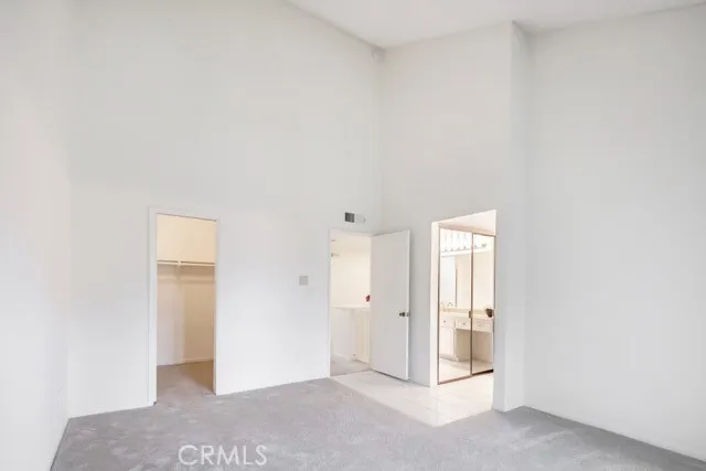 primary bedroom with cathedral ceiling