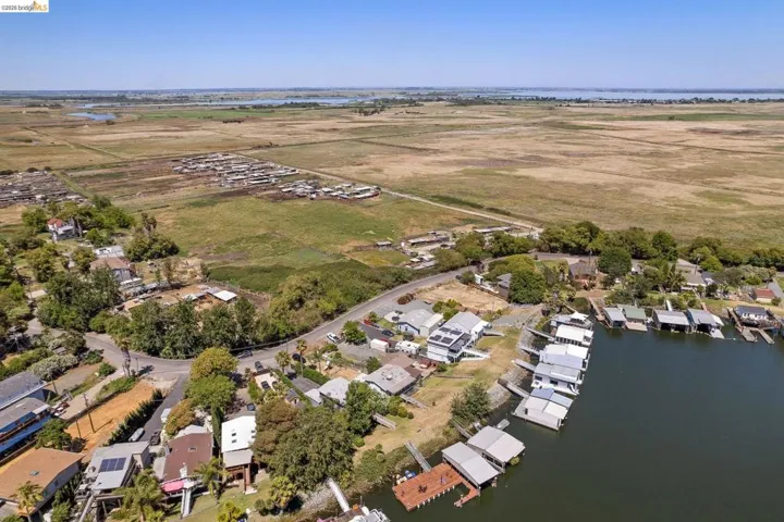 Waterfront property featuring private docks and boat covers