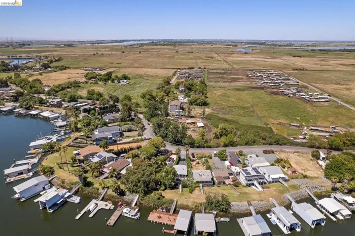Waterfront properties featuring private boat docks and surrounding natural landscapes