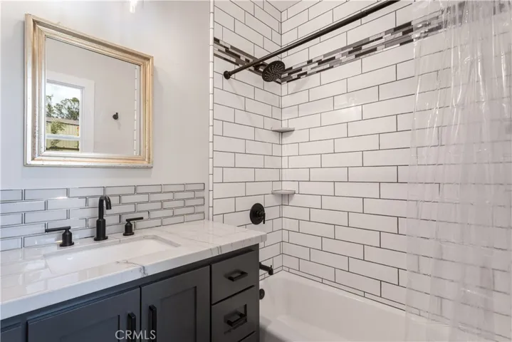 Second bath has tub/shower combo.