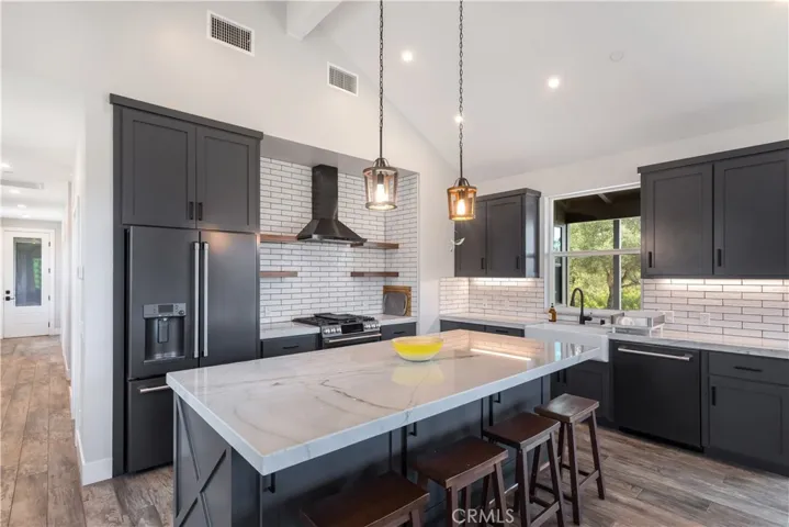 Quartz countertops, tile flooring.