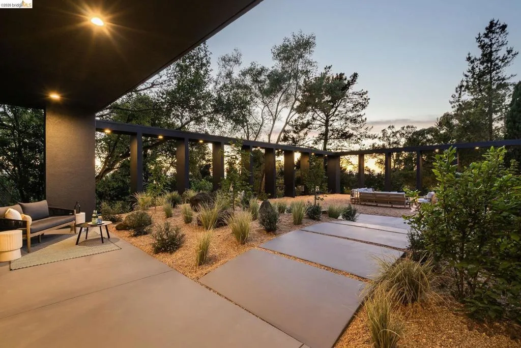 Expansive outdoor patio area featuring a covered section with recessed lighting
